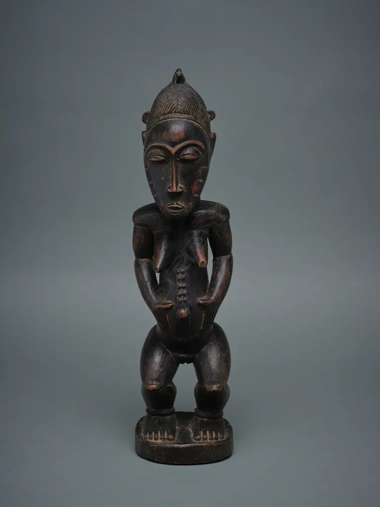 A Baule wooden female figure - Ivory Coast – Africa, Image 1++